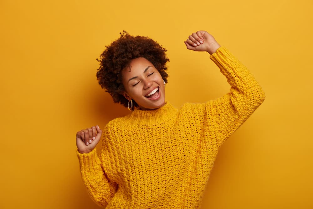female event organizer doing a happy dance